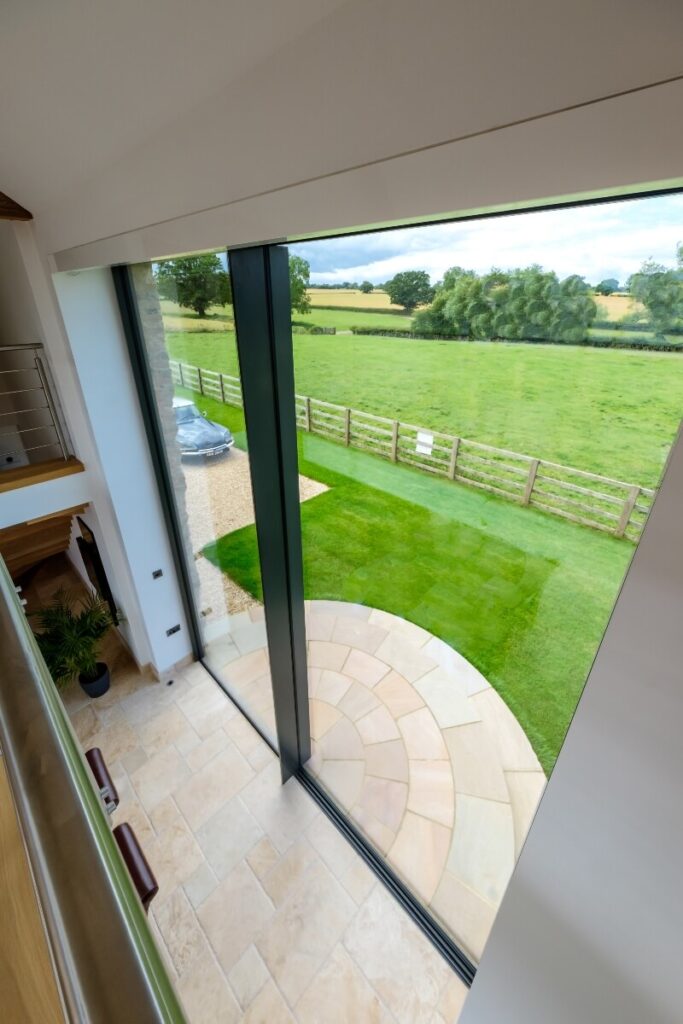 Outlook through glass doors in barn conversion